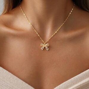Anthropologie Gold Bow Pendant Necklace